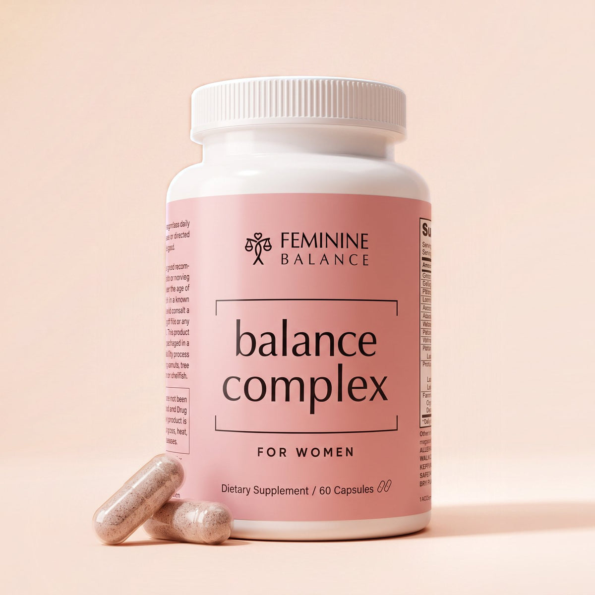 Balance Complex bottle square to camera on blush with two capsules