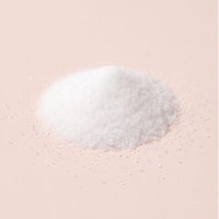 Sparkling white D-mannose crystals on blush-oat